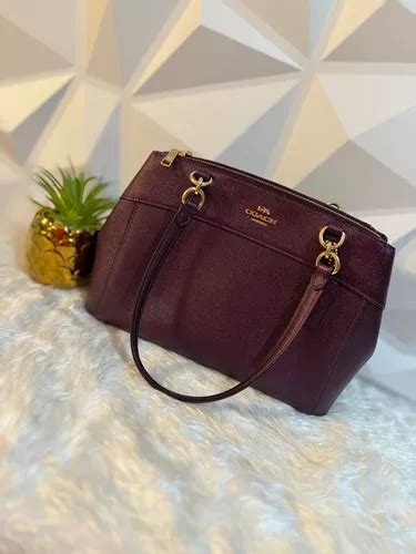 bolsa coach morada original precio|bolsas coach.